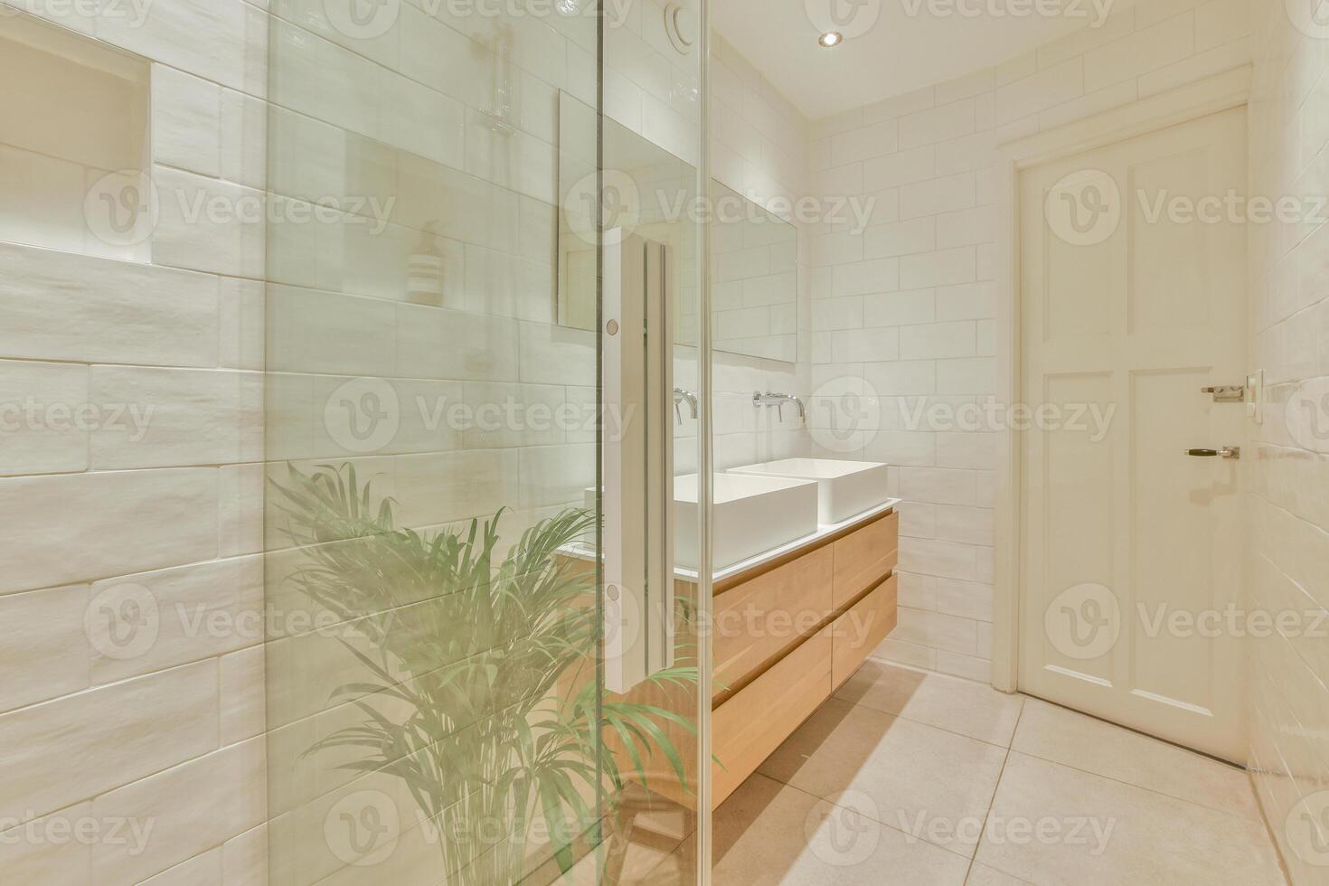 A bathroom with a sink and a shower stall photo