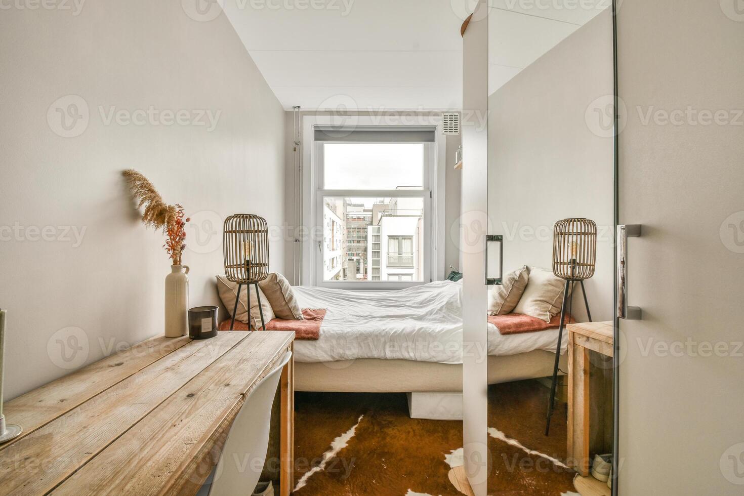 A bedroom with a bed and a mirror photo