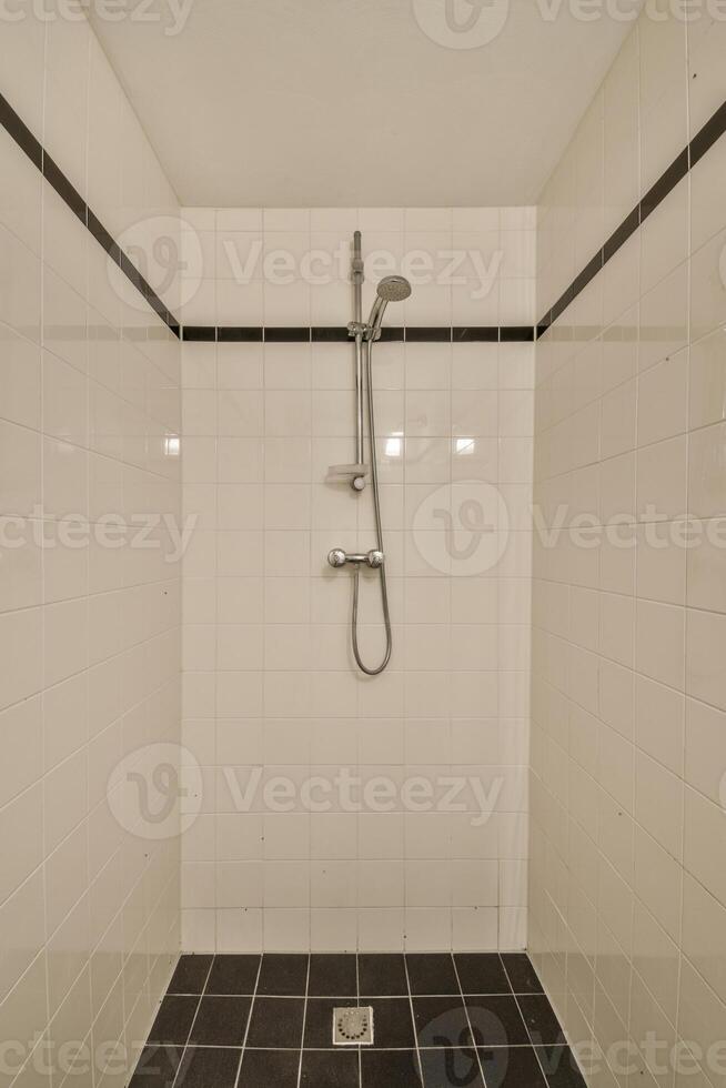 A shower with a shower head and a shower head photo