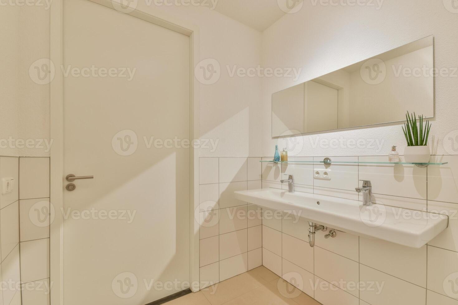 A bathroom with a sink and mirror photo