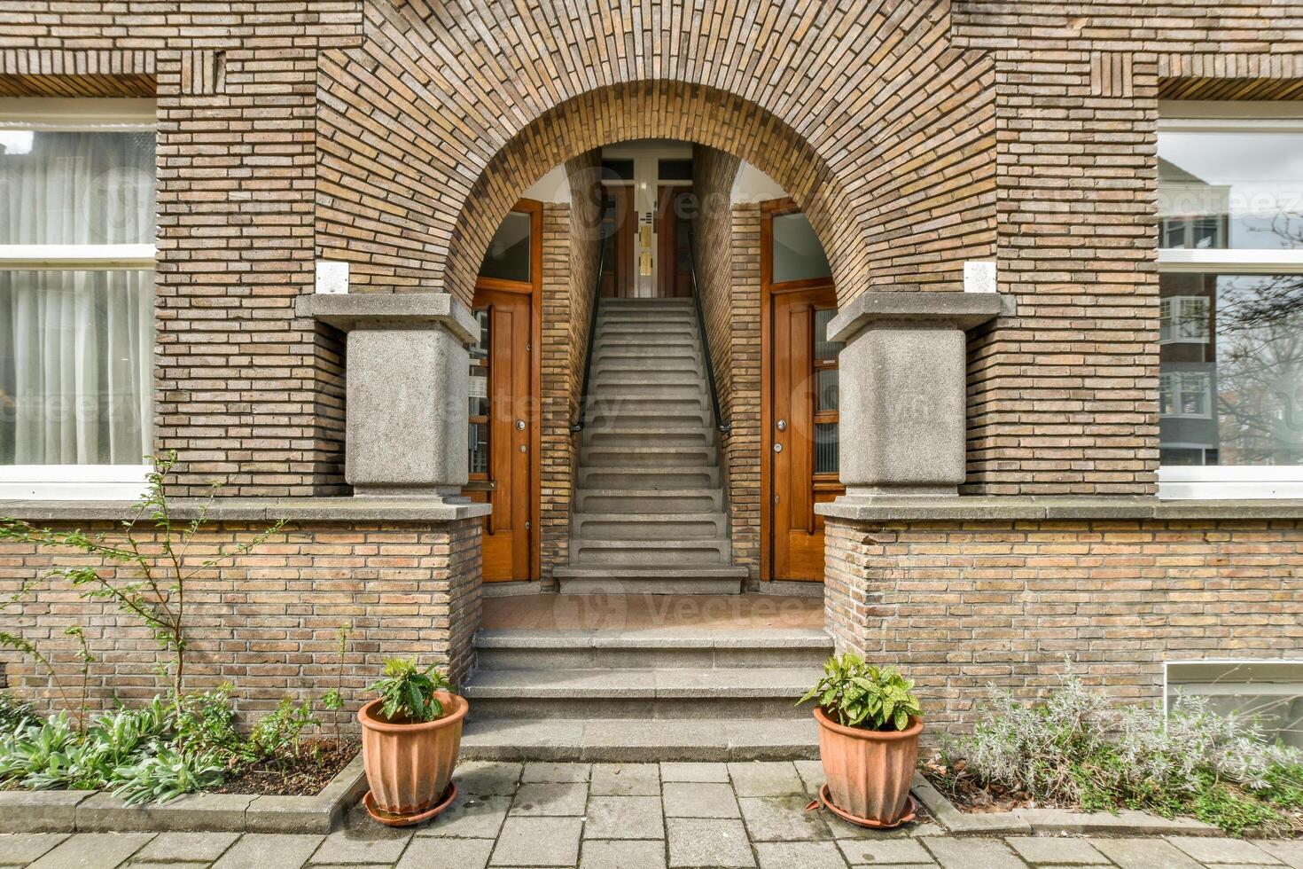 Brick building with arched door photo