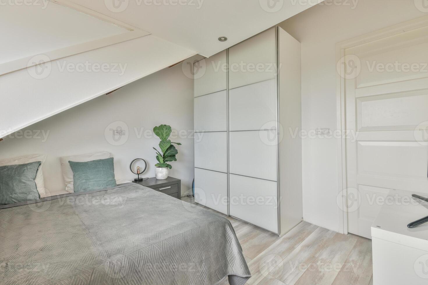 A bedroom with a bed, dresser and a tv photo