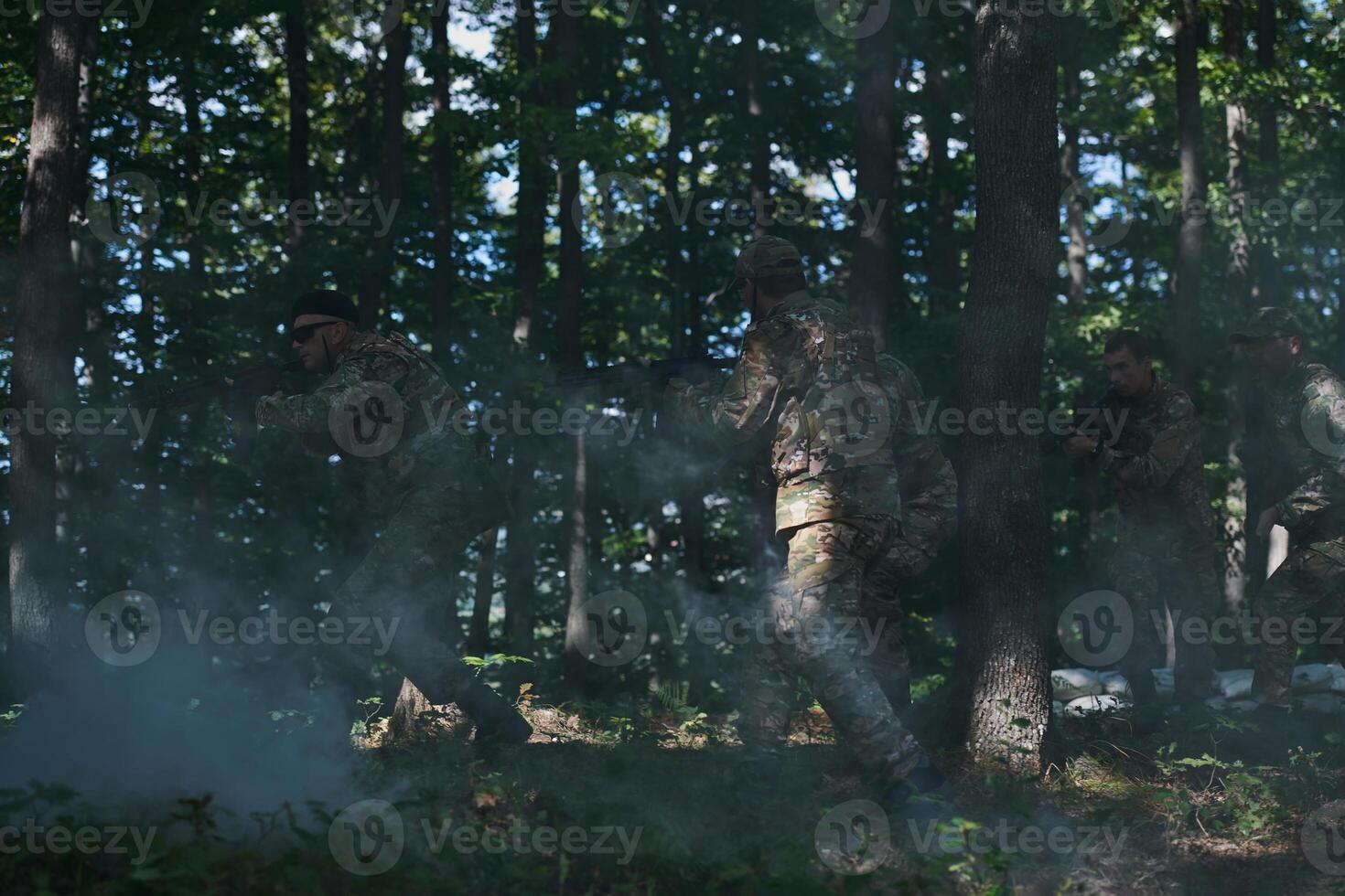 A specialized military antiterrorist unit conducts a covert operation in dense, hazardous woodland, demonstrating precision, discipline, and strategic readiness photo