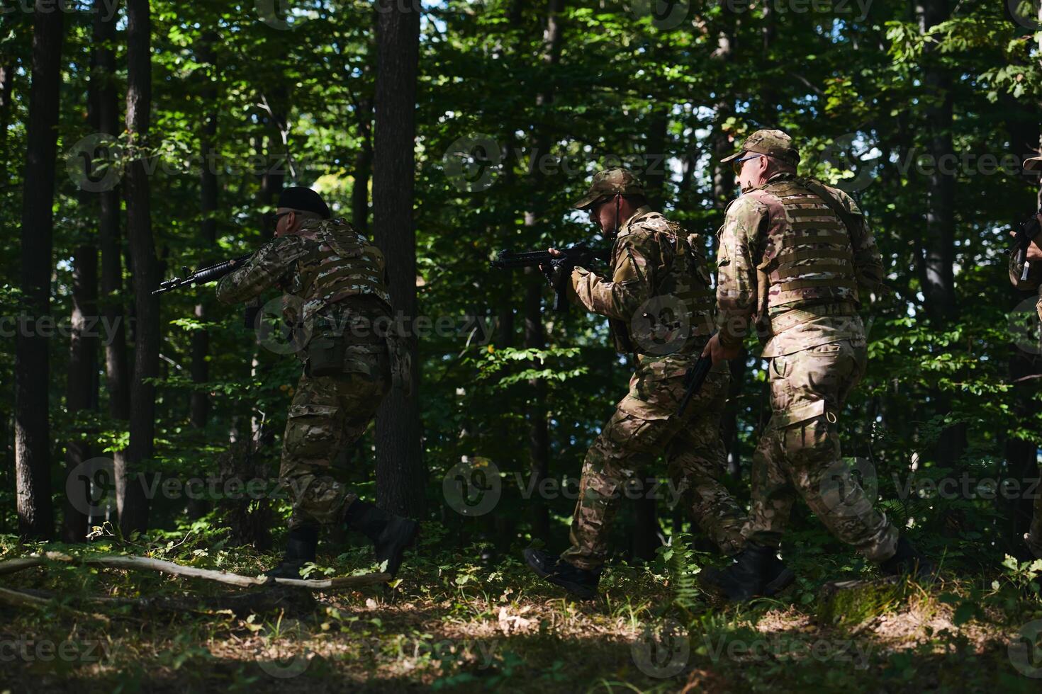 A specialized military antiterrorist unit conducts a covert operation in dense, hazardous woodland, demonstrating precision, discipline, and strategic readiness photo