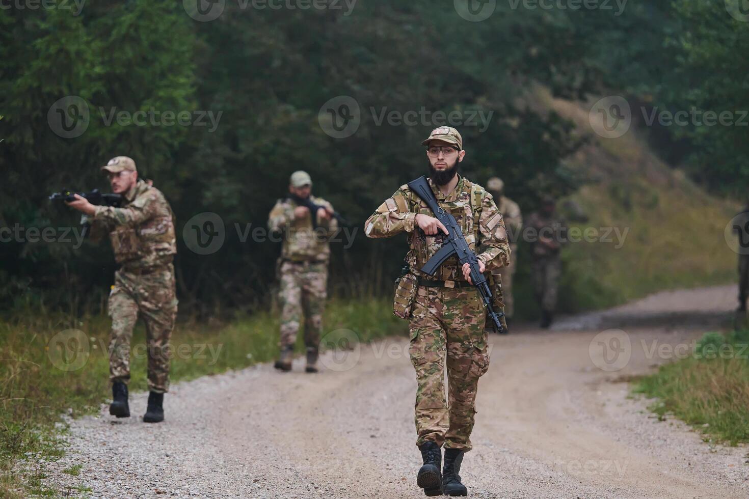 A disciplined and specialized military unit, donned in camouflage, strategically patrolling and maintaining control in a high-stakes environment, showcasing their precision, unity, and readiness for photo