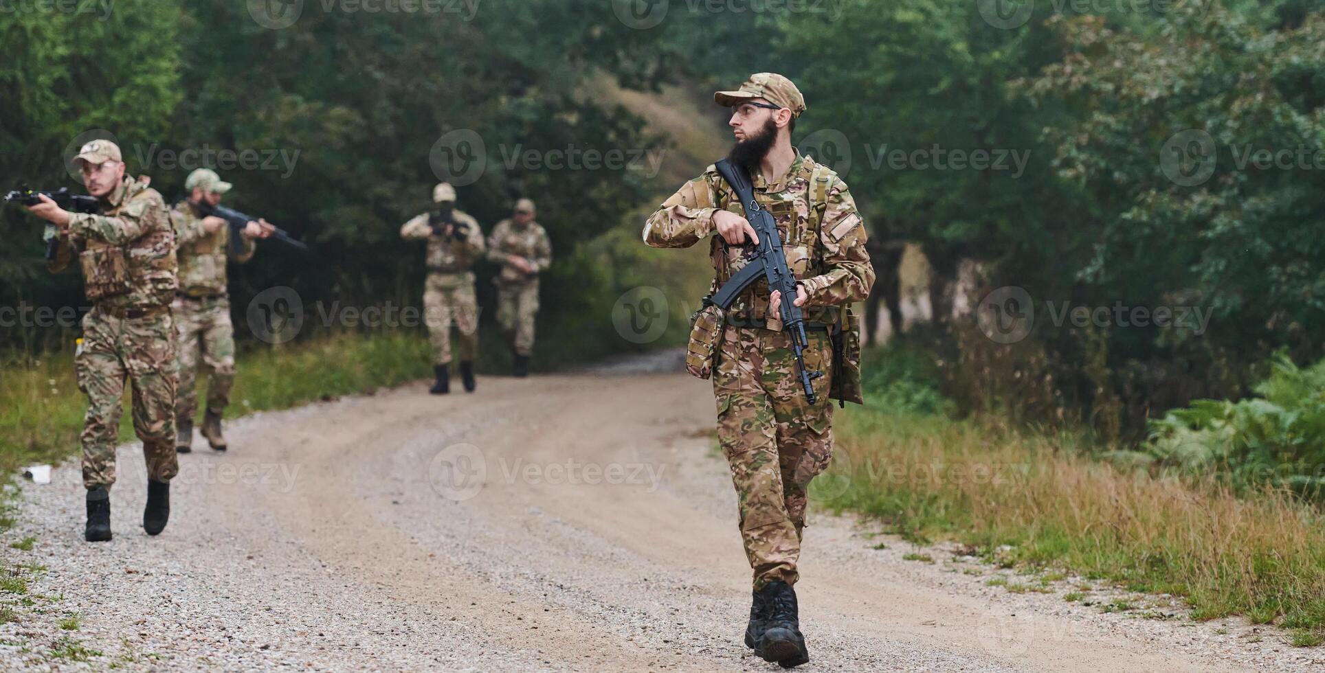 A disciplined and specialized military unit, donned in camouflage, strategically patrolling and maintaining control in a high-stakes environment, showcasing their precision, unity, and readiness for photo