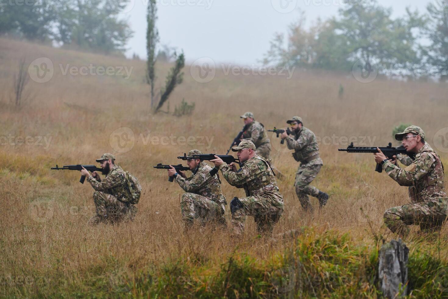 A disciplined and specialized military unit, donned in camouflage, strategically patrolling and maintaining control in a high-stakes environment, showcasing their precision, unity, and readiness for photo