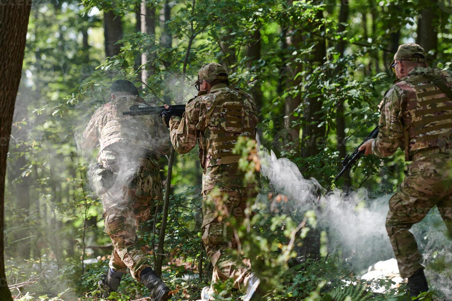 A specialized military antiterrorist unit conducts a covert operation in dense, hazardous woodland, demonstrating precision, discipline, and strategic readiness photo