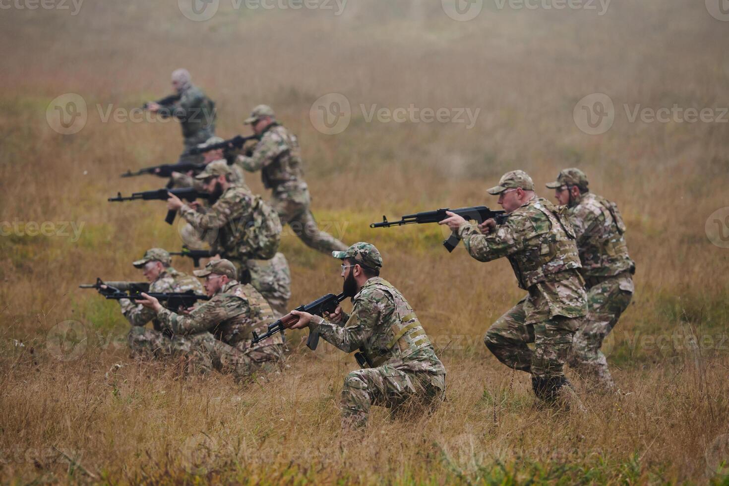 A disciplined and specialized military unit, donned in camouflage, strategically patrolling and maintaining control in a high-stakes environment, showcasing their precision, unity, and readiness for photo