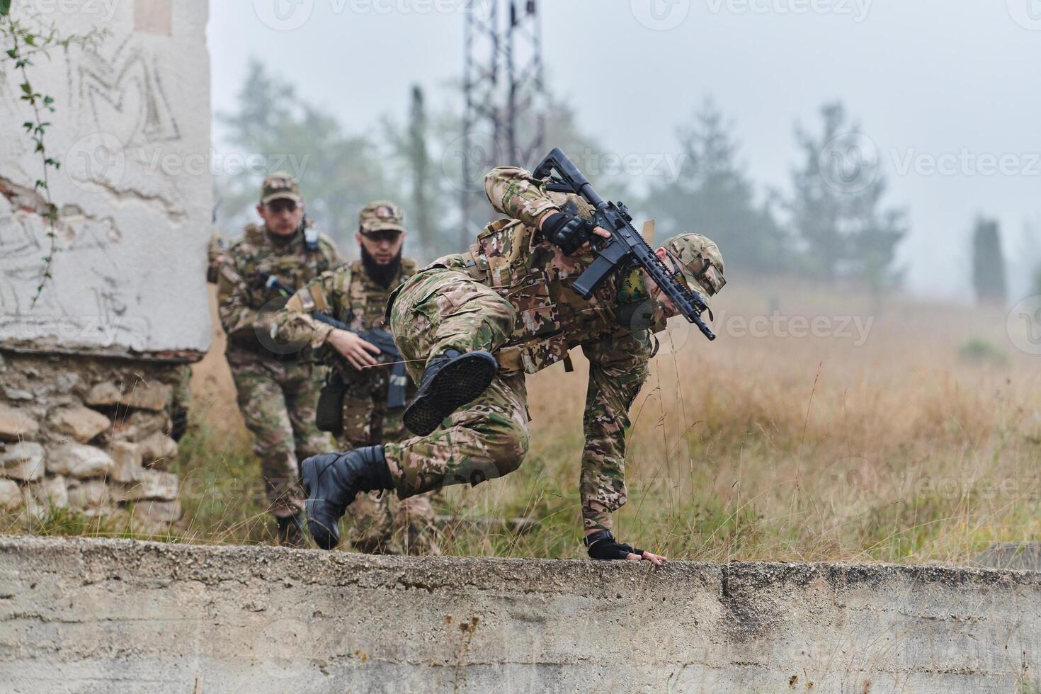 A highly trained elite military unit, clad in camouflage, skillfully navigates through perilous forest terrain, overcoming obstacles and executing a precise and covert mission photo