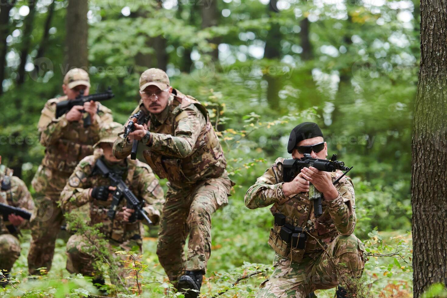 A disciplined and specialized military unit, donned in camouflage, strategically patrolling and maintaining control in a high-stakes environment, showcasing their precision, unity, and readiness for photo