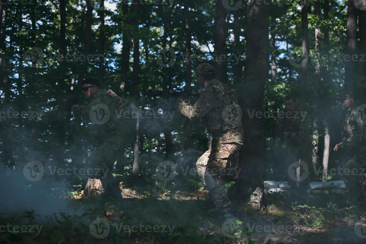 A specialized military antiterrorist unit conducts a covert operation in dense, hazardous woodland, demonstrating precision, discipline, and strategic readiness photo