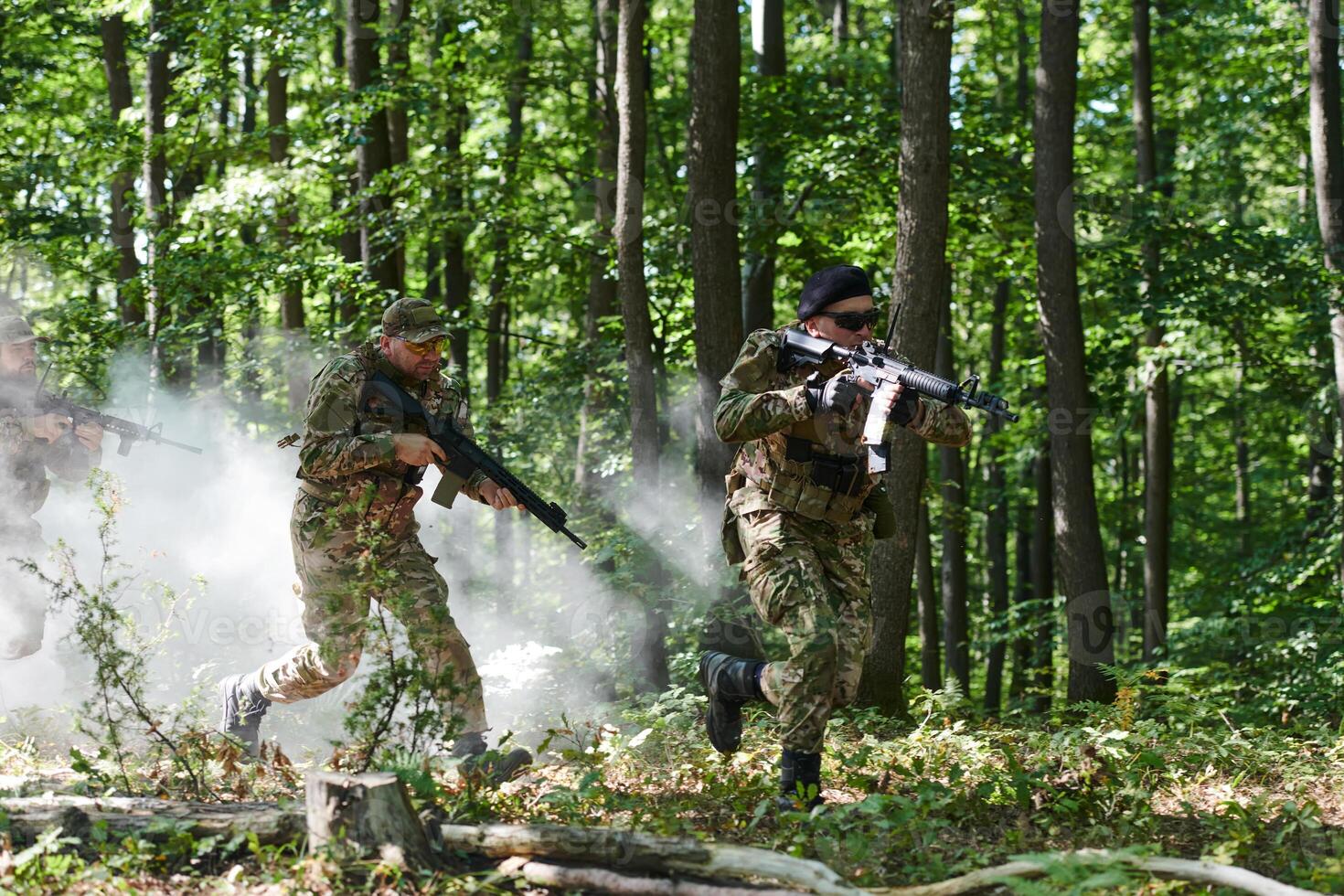 A specialized military antiterrorist unit conducts a covert operation in dense, hazardous woodland, demonstrating precision, discipline, and strategic readiness photo