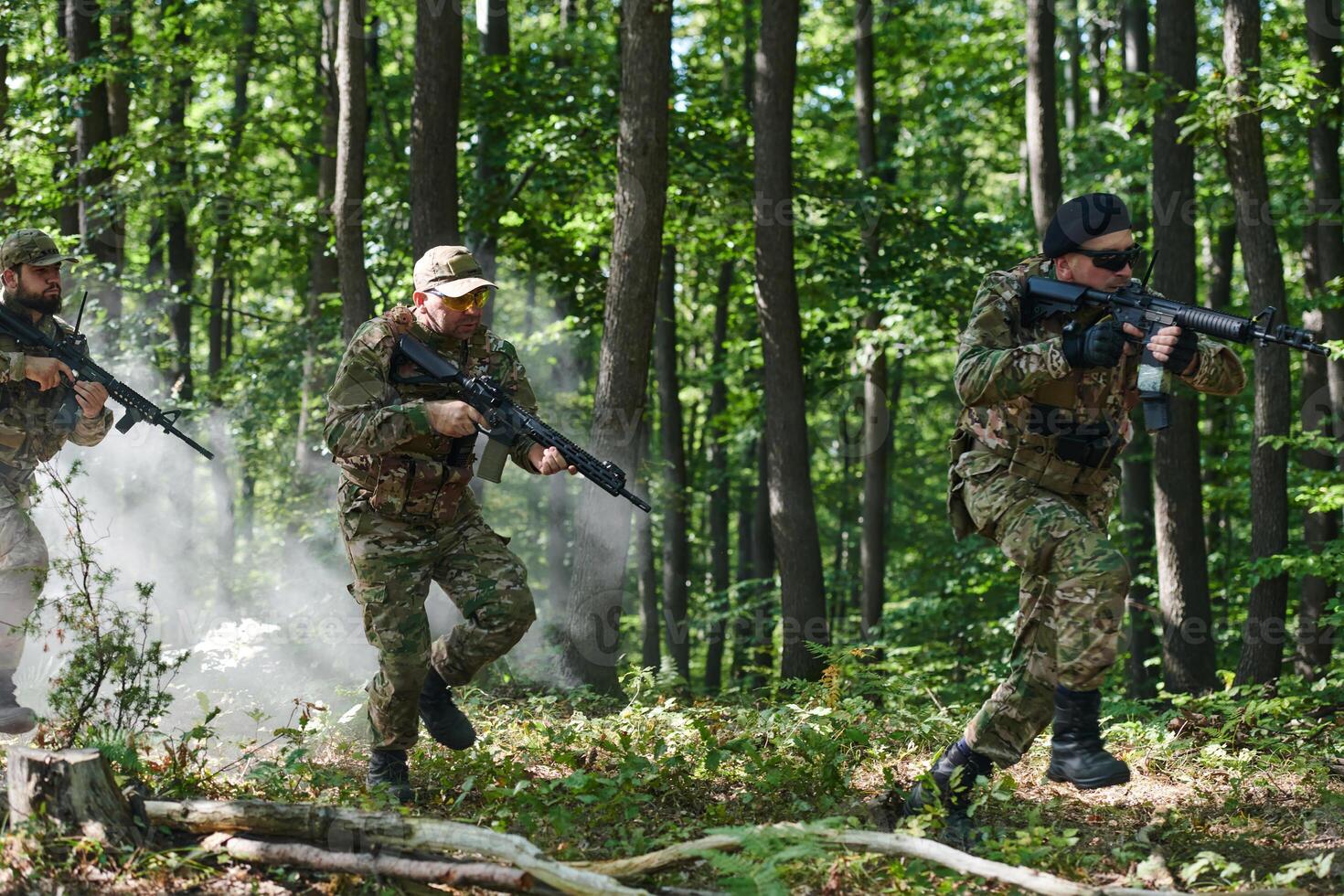 A specialized military antiterrorist unit conducts a covert operation in dense, hazardous woodland, demonstrating precision, discipline, and strategic readiness photo