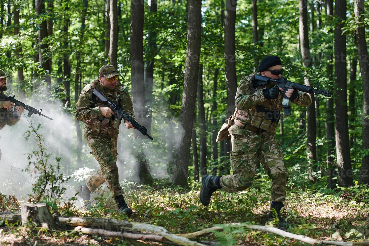 A specialized military antiterrorist unit conducts a covert operation in dense, hazardous woodland, demonstrating precision, discipline, and strategic readiness photo