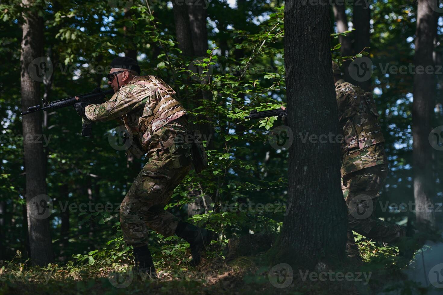 A specialized military antiterrorist unit conducts a covert operation in dense, hazardous woodland, demonstrating precision, discipline, and strategic readiness photo