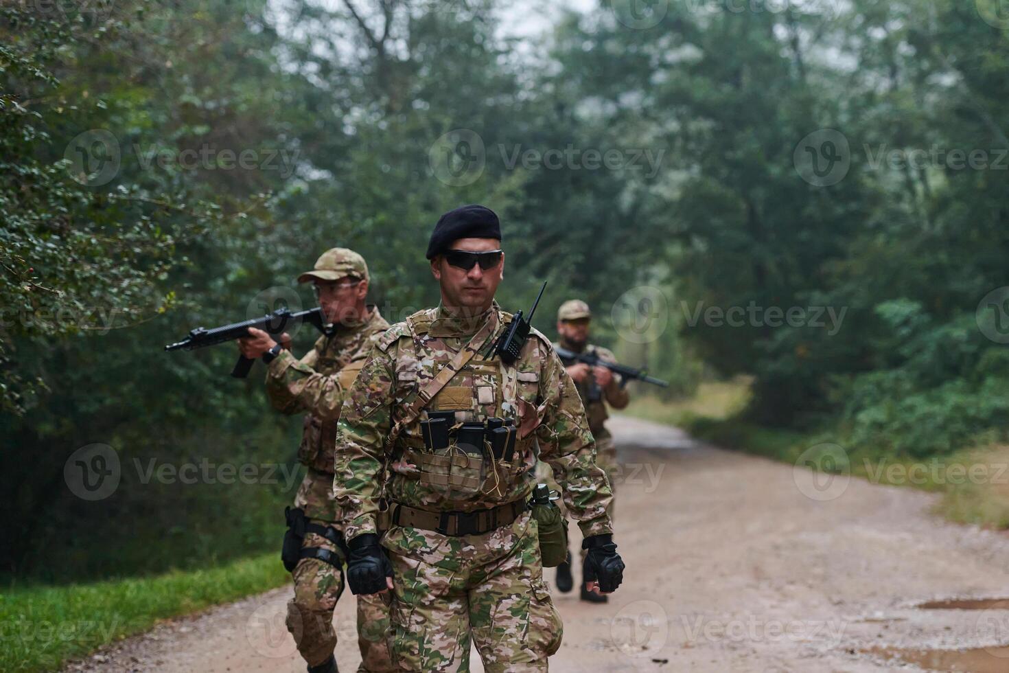A disciplined and specialized military unit, donned in camouflage, strategically patrolling and maintaining control in a high-stakes environment, showcasing their precision, unity, and readiness for photo