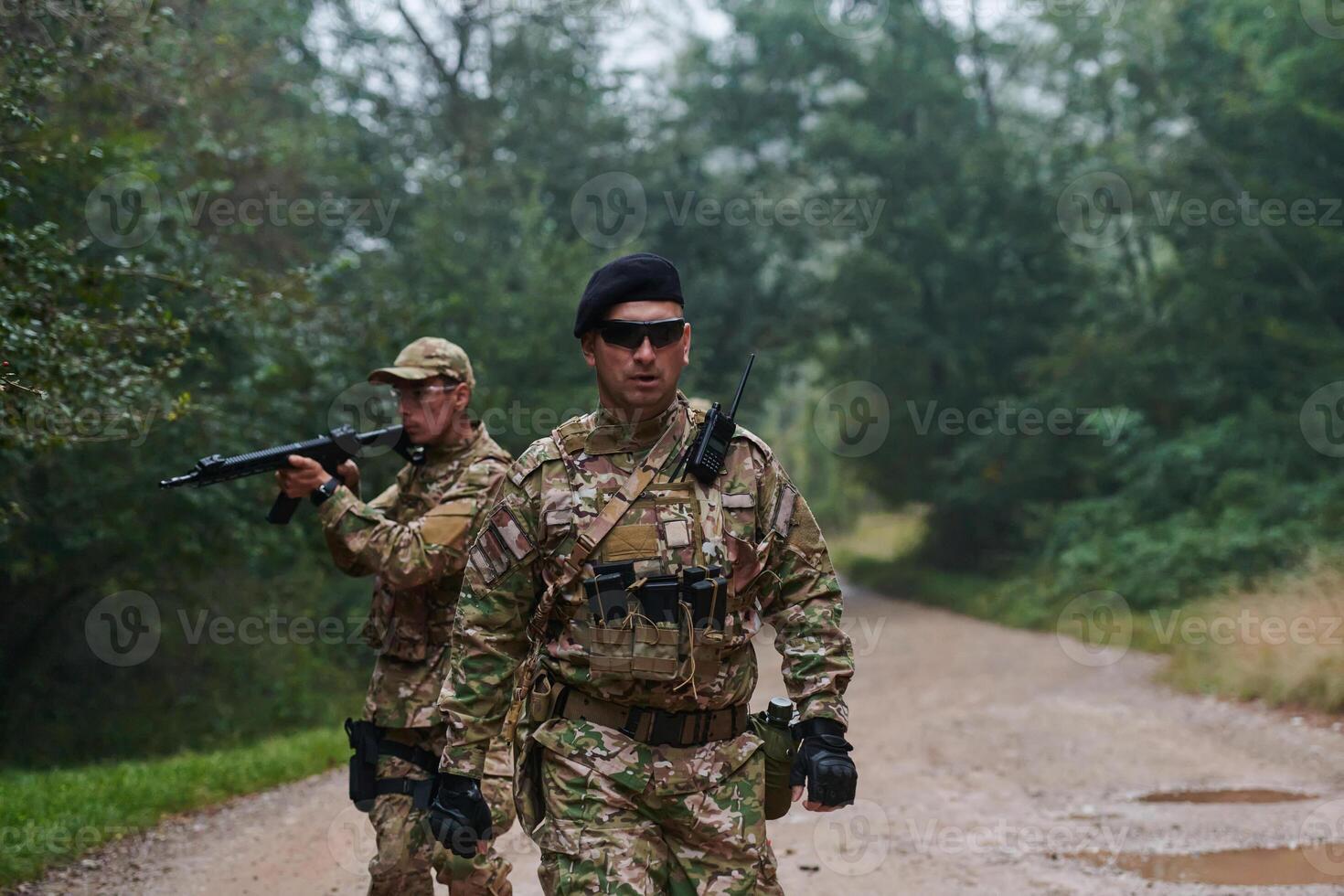 A disciplined and specialized military unit, donned in camouflage, strategically patrolling and maintaining control in a high-stakes environment, showcasing their precision, unity, and readiness for photo