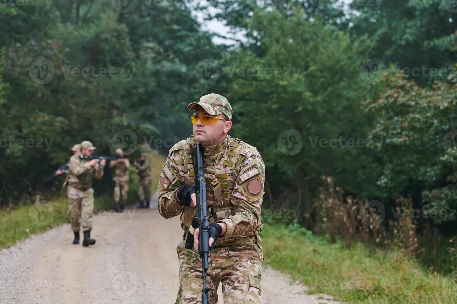 A disciplined and specialized military unit, donned in camouflage, strategically patrolling and maintaining control in a high-stakes environment, showcasing their precision, unity, and readiness for photo