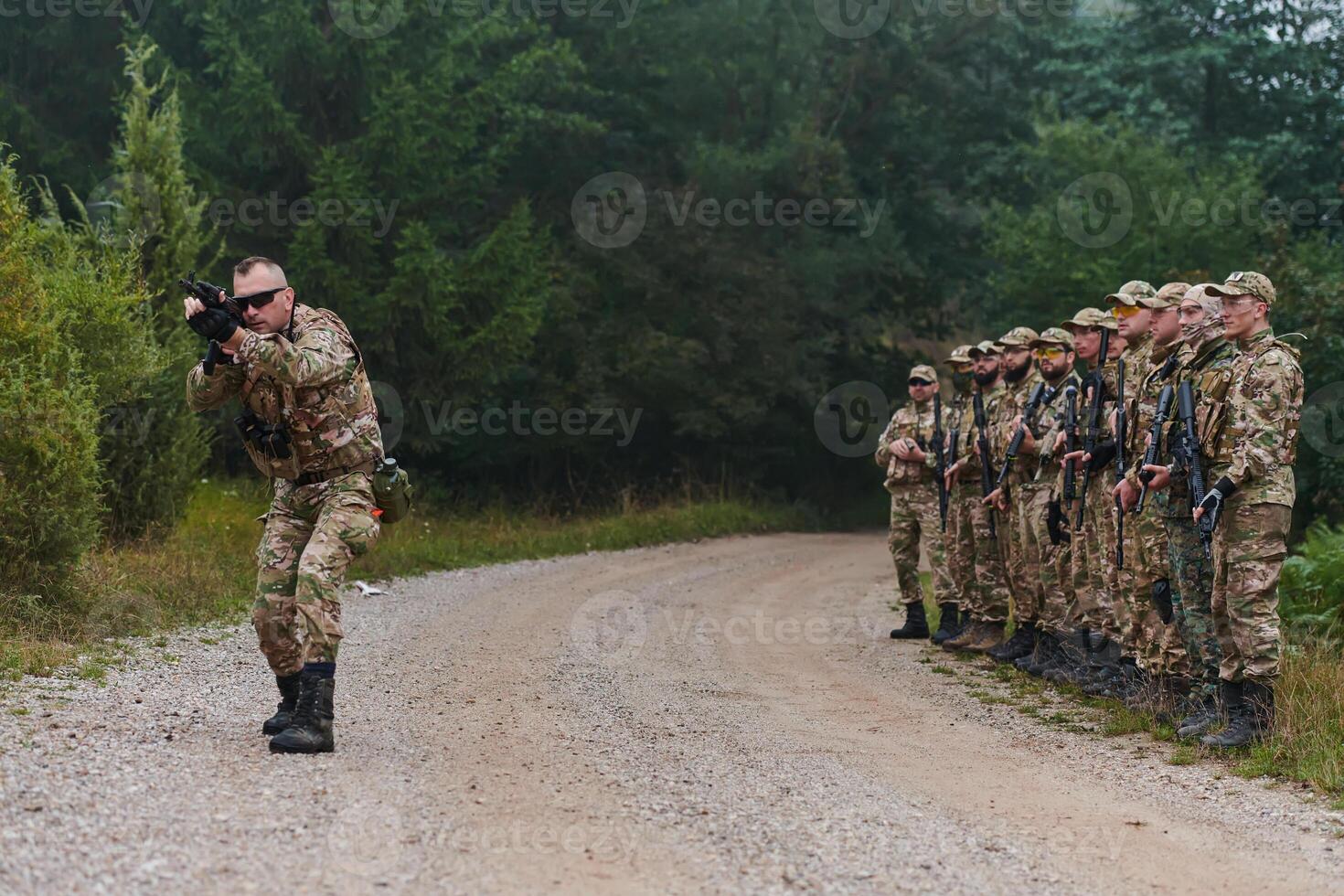 A major imparts precise military instructions to his elite unit, embodying strategic leadership as they gather for a briefing on tactical maneuvers and disciplined coordination photo
