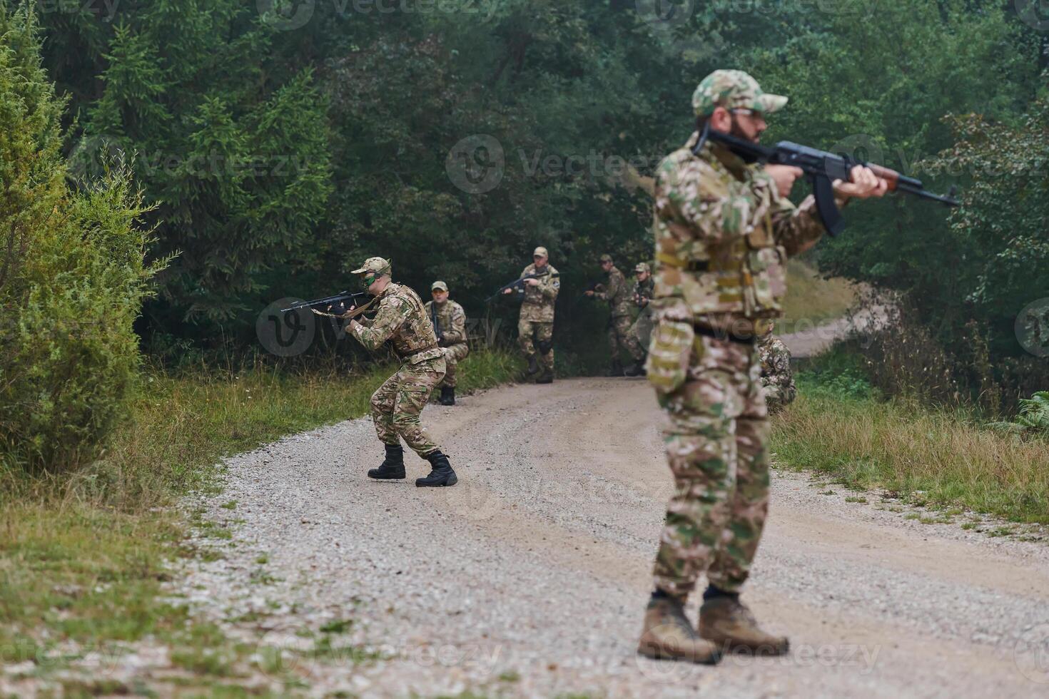 A disciplined and specialized military unit, donned in camouflage, strategically patrolling and maintaining control in a high-stakes environment, showcasing their precision, unity, and readiness for photo