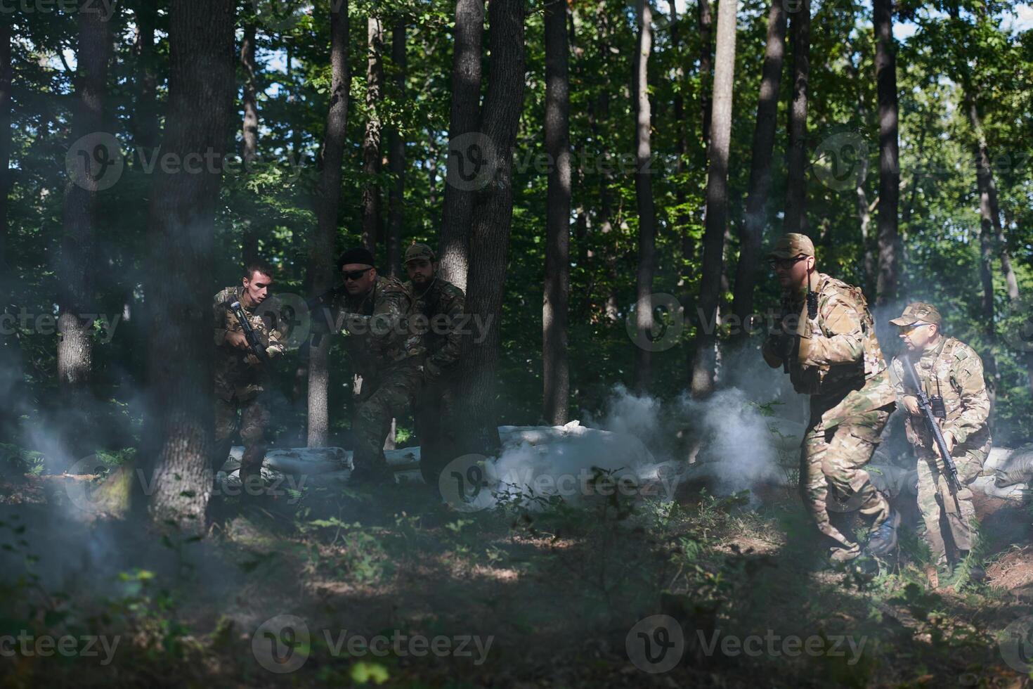 A specialized military antiterrorist unit conducts a covert operation in dense, hazardous woodland, demonstrating precision, discipline, and strategic readiness photo