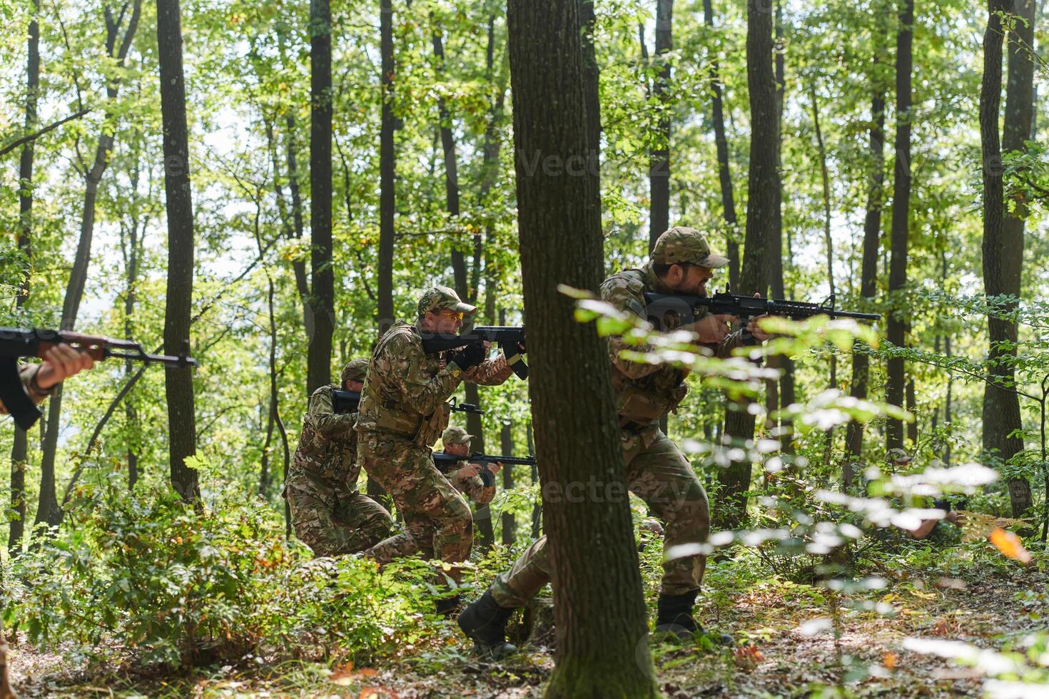 A specialized military antiterrorist unit conducts a covert operation in dense, hazardous woodland, demonstrating precision, discipline, and strategic readiness photo