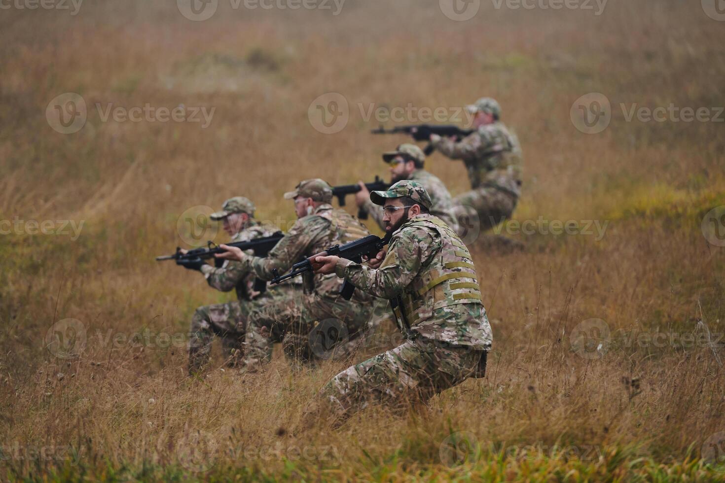 A disciplined and specialized military unit, donned in camouflage, strategically patrolling and maintaining control in a high-stakes environment, showcasing their precision, unity, and readiness for photo