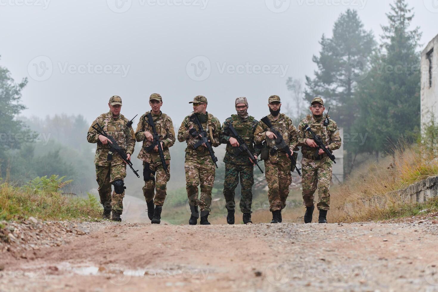 A disciplined and specialized military unit, donned in camouflage, strategically patrolling and maintaining control in a high-stakes environment, showcasing their precision, unity, and readiness for photo