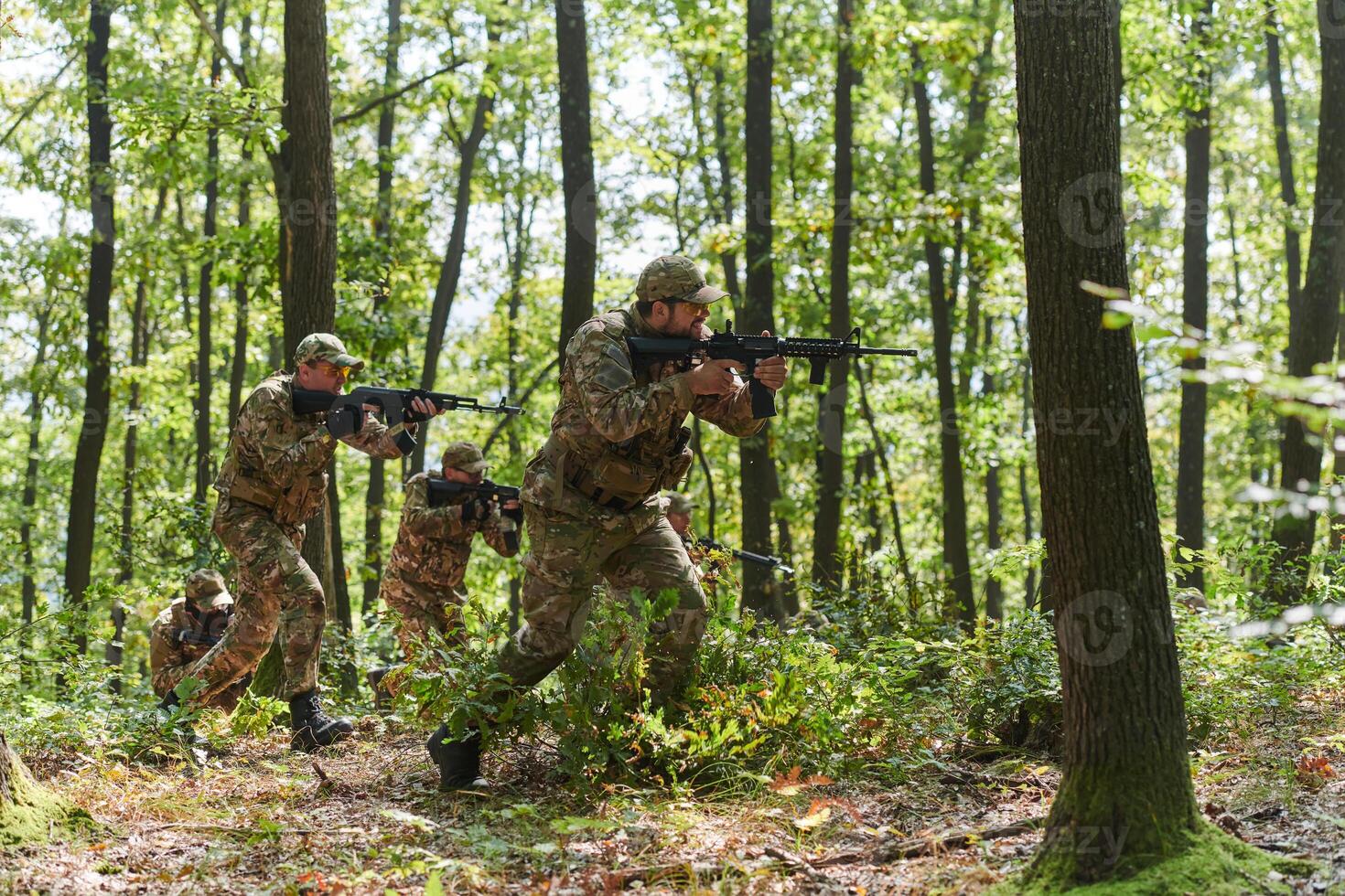 A specialized military antiterrorist unit conducts a covert operation in dense, hazardous woodland, demonstrating precision, discipline, and strategic readiness photo