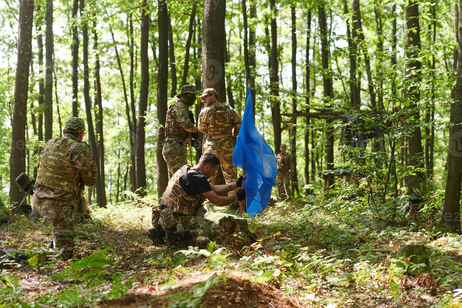 A disciplined and specialized military unit, donned in camouflage, strategically patrolling and maintaining control in a high-stakes environment, showcasing their precision, unity, and readiness for photo