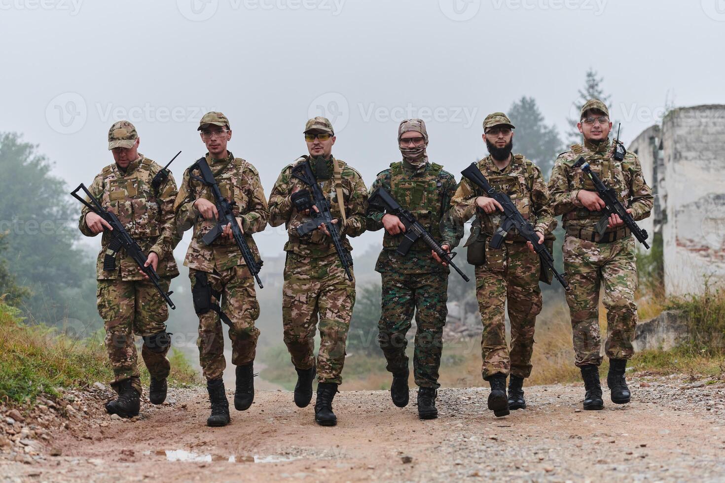 A disciplined and specialized military unit, donned in camouflage, strategically patrolling and maintaining control in a high-stakes environment, showcasing their precision, unity, and readiness for photo