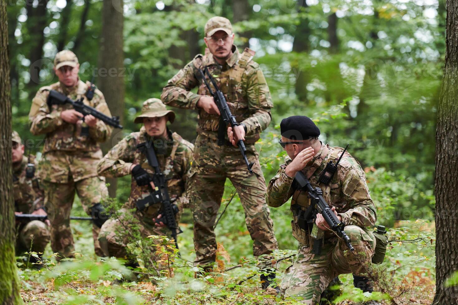 A disciplined and specialized military unit, donned in camouflage, strategically patrolling and maintaining control in a high-stakes environment, showcasing their precision, unity, and readiness for photo