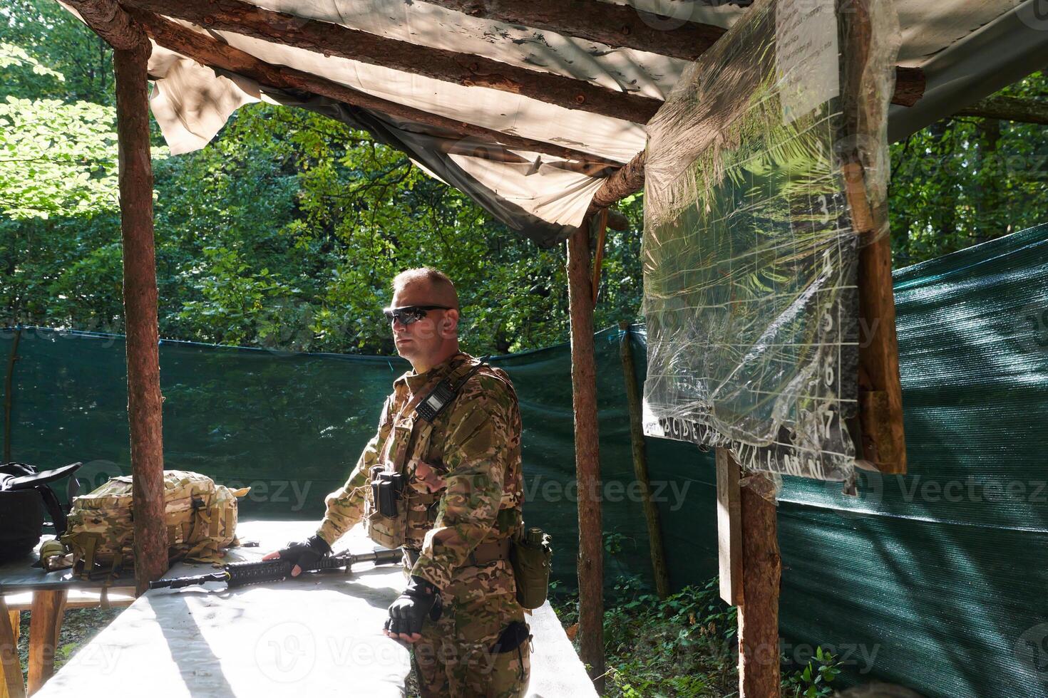 The esteemed leader of an elite military unit, strategic brilliance unfolds as he meticulously devises tactical plans for the upcoming military operation, surrounded by cutting-edge technology and a photo