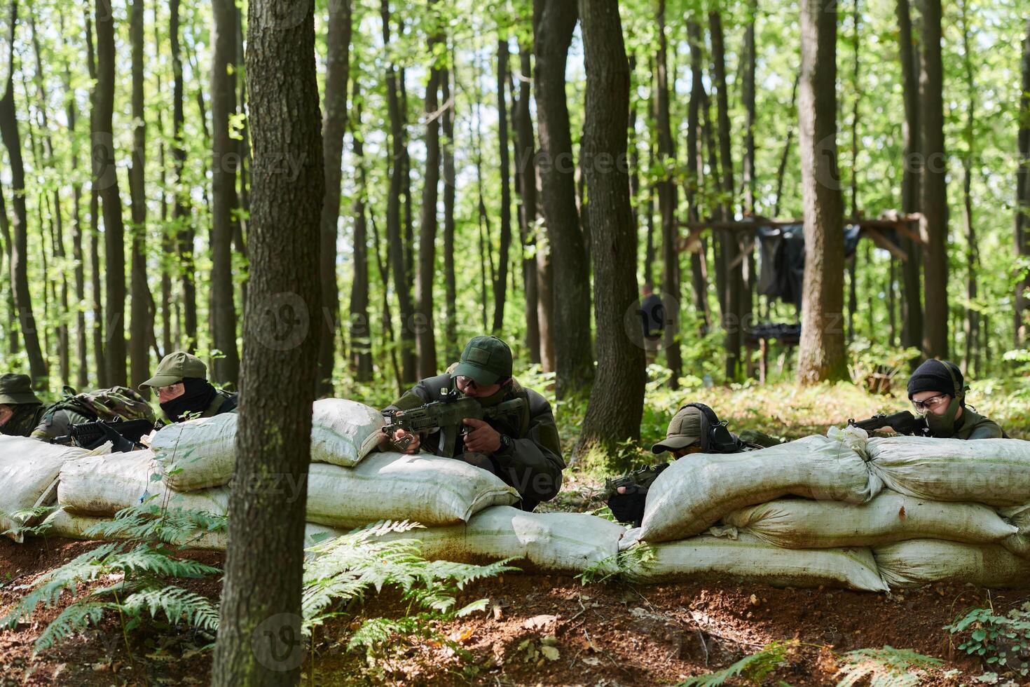 A disciplined and specialized military unit, donned in camouflage, strategically patrolling and maintaining control in a high-stakes environment, showcasing their precision, unity, and readiness for photo