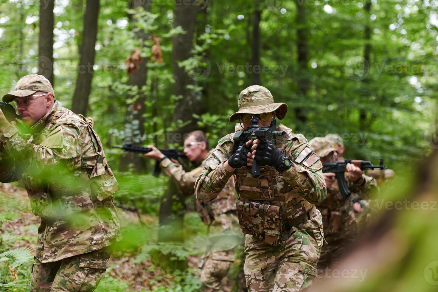 A disciplined and specialized military unit, donned in camouflage, strategically patrolling and maintaining control in a high-stakes environment, showcasing their precision, unity, and readiness for photo