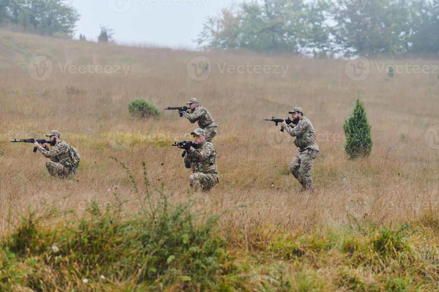 A disciplined and specialized military unit, donned in camouflage, strategically patrolling and maintaining control in a high-stakes environment, showcasing their precision, unity, and readiness for photo