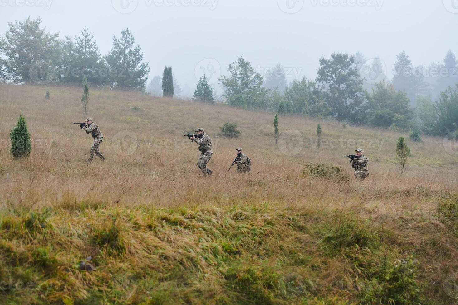 A disciplined and specialized military unit, donned in camouflage, strategically patrolling and maintaining control in a high-stakes environment, showcasing their precision, unity, and readiness for photo