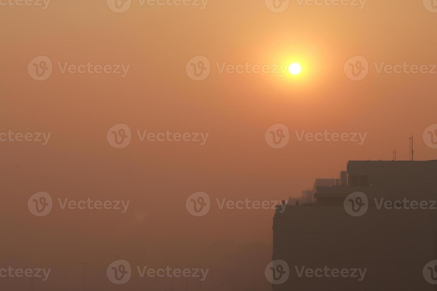 Thick clouds of Smoke darken the morning sun from a huge fire in the National Park near the Northwest section of Brasilia, known as Noroeste photo