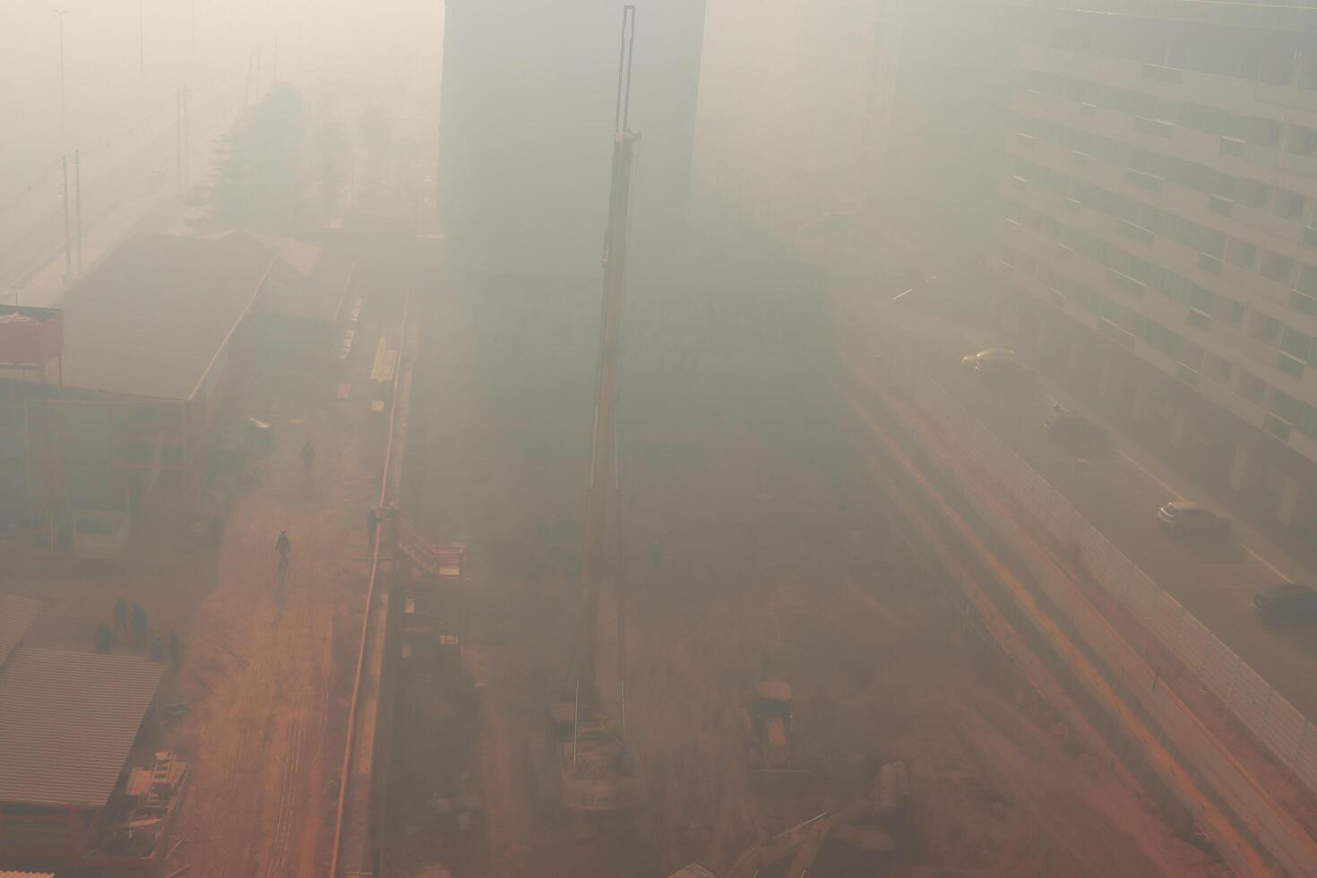 Brasilia, Brazil September 16 2024 A thick blanket of smoke covers the Northwest section of Brasilia, impeding the construction work on a New Apartment building the result of Arson photo