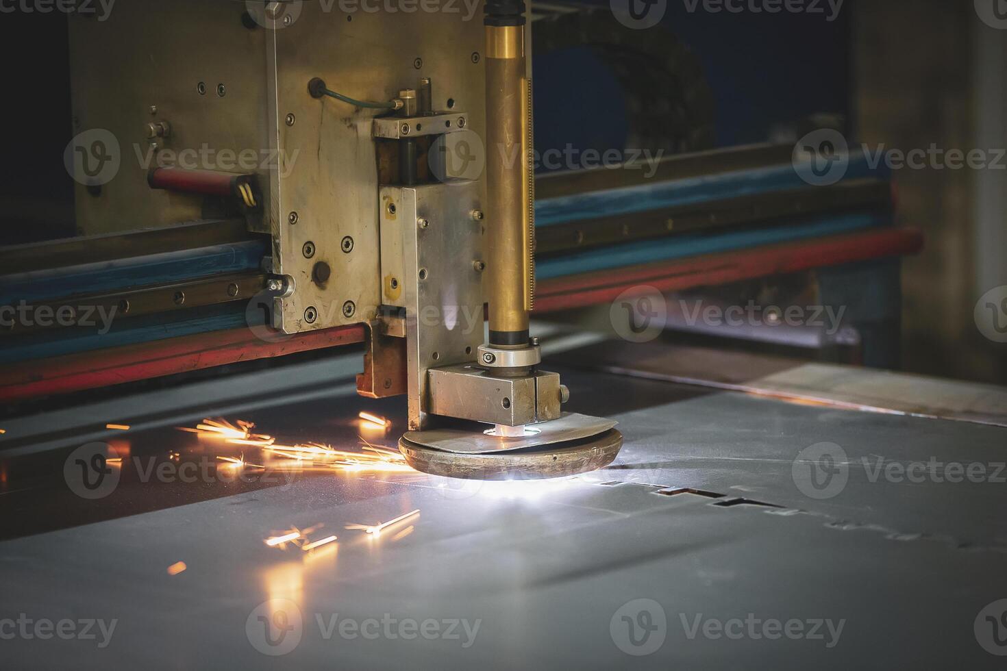 Plasma cutting of metal.The machine cuts iron with sparks.Industrial manufacture of products from iron sheets photo