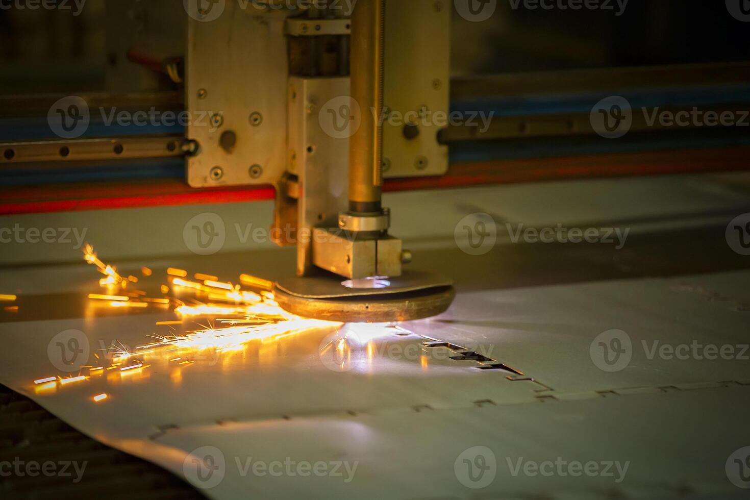 Plasma cutting of metal.The machine cuts iron with sparks.Industrial manufacture of products from iron sheets photo