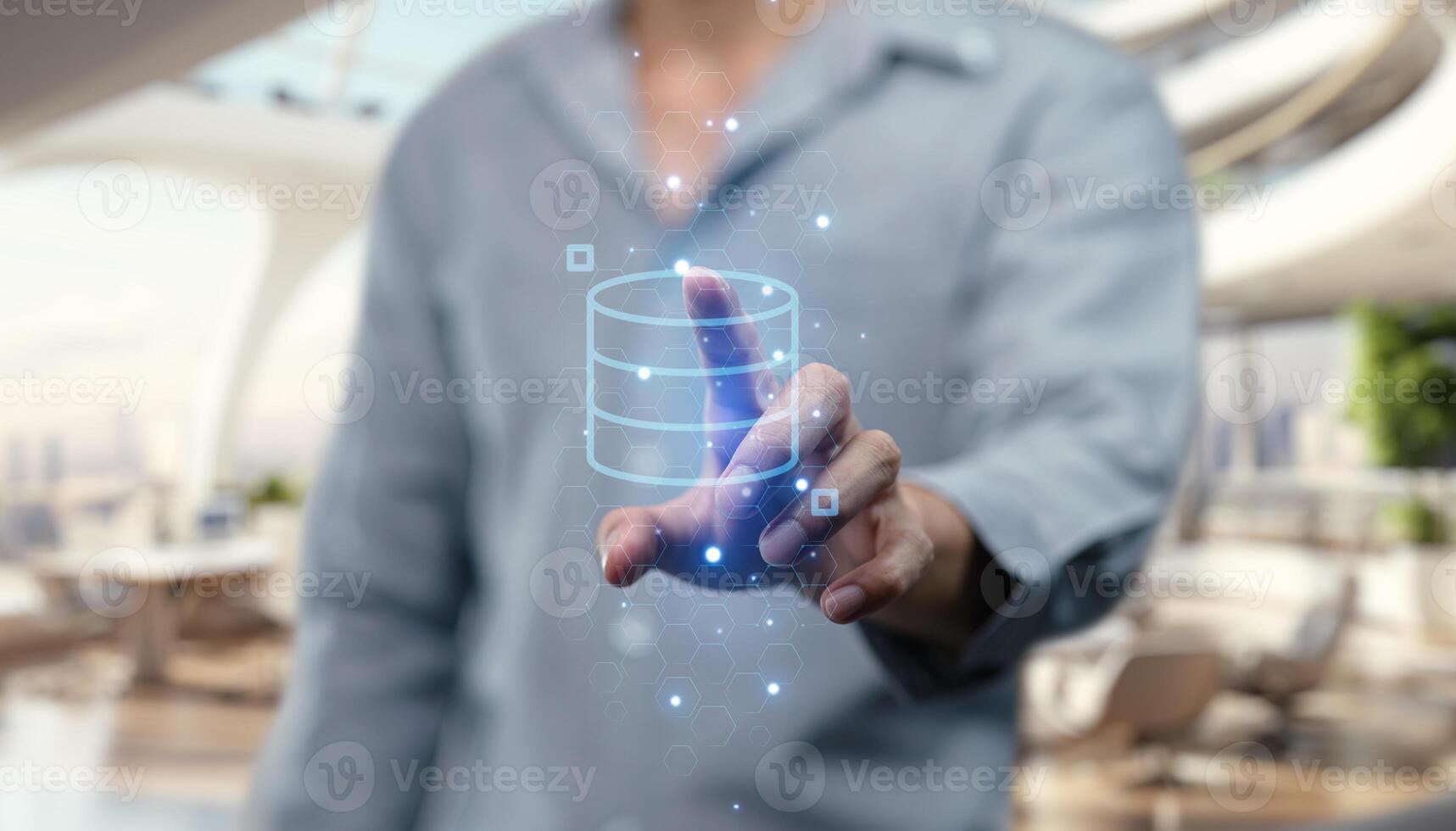 A man is touching a data icon on a screen photo
