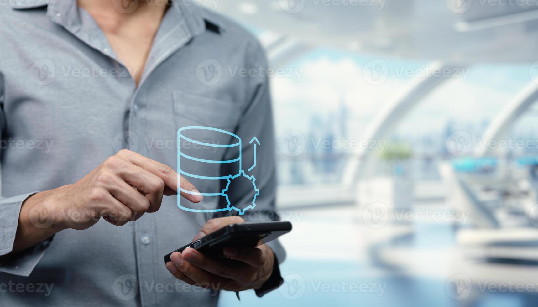 A man holding a smart phone with a data line on it photo