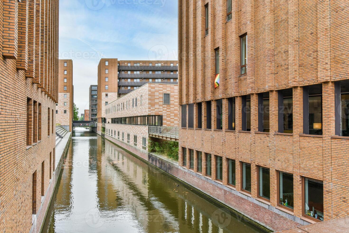 A canal with a bridge photo