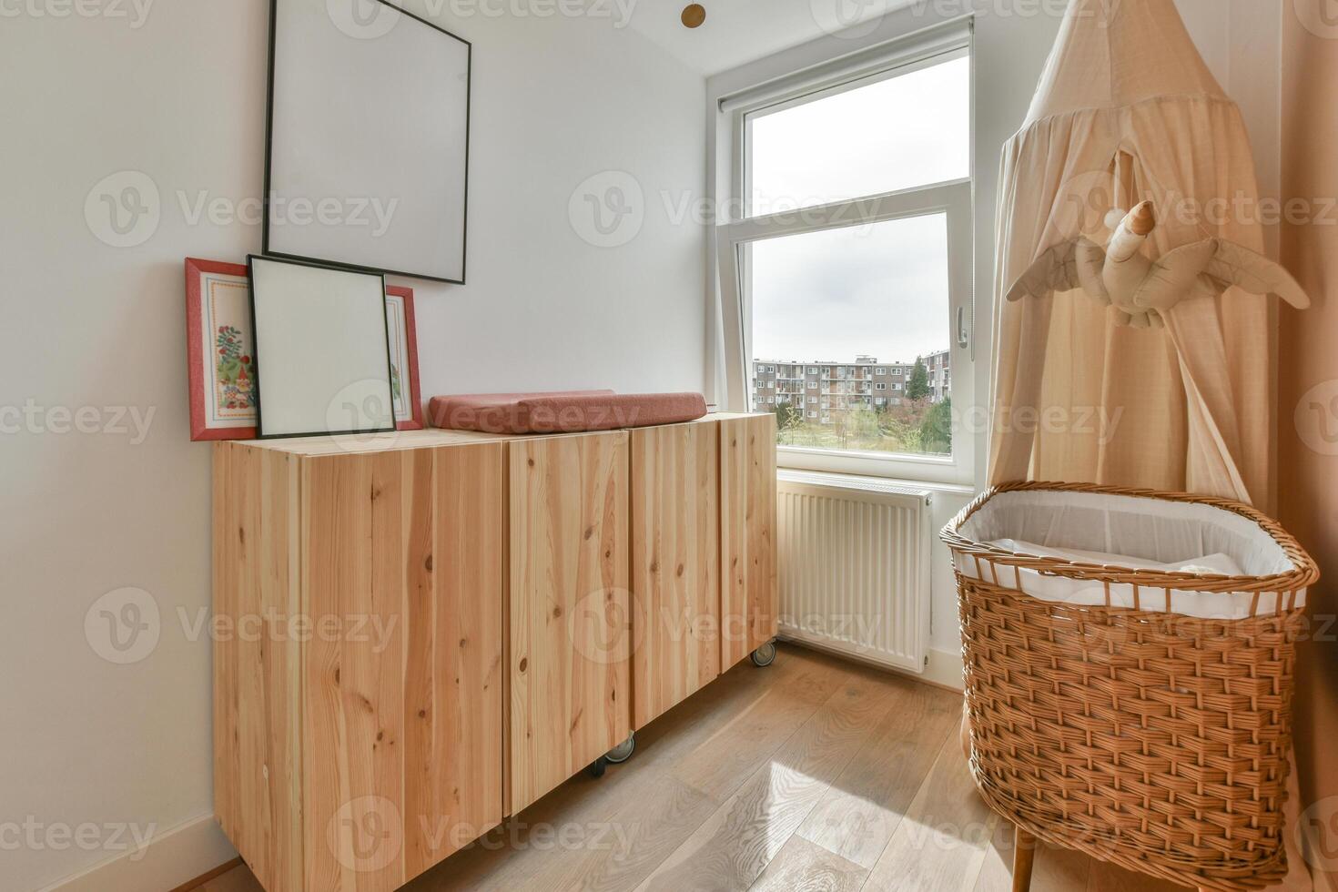 A wooden cabinet with a basket on top photo