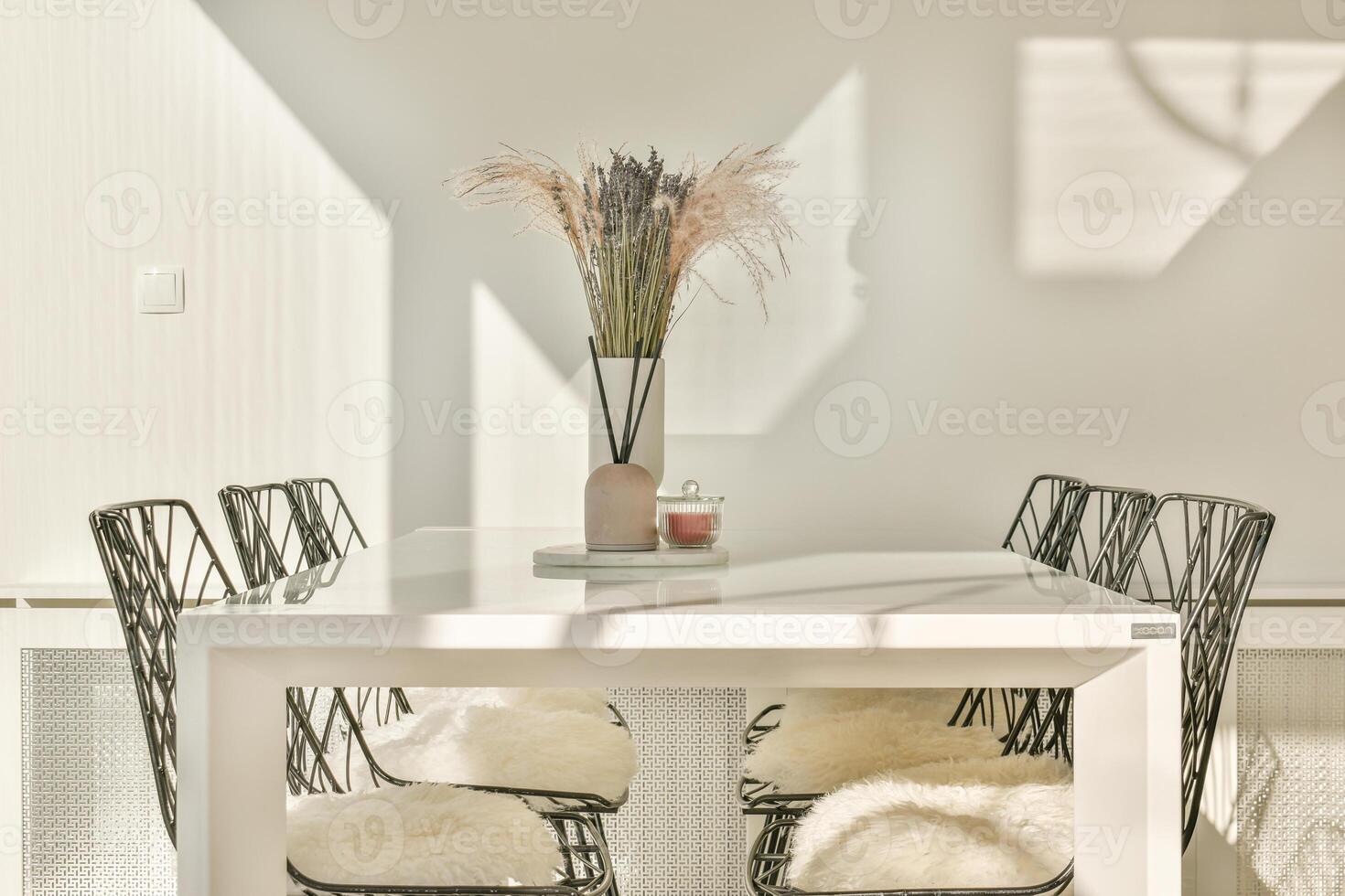 A white table with four chairs photo