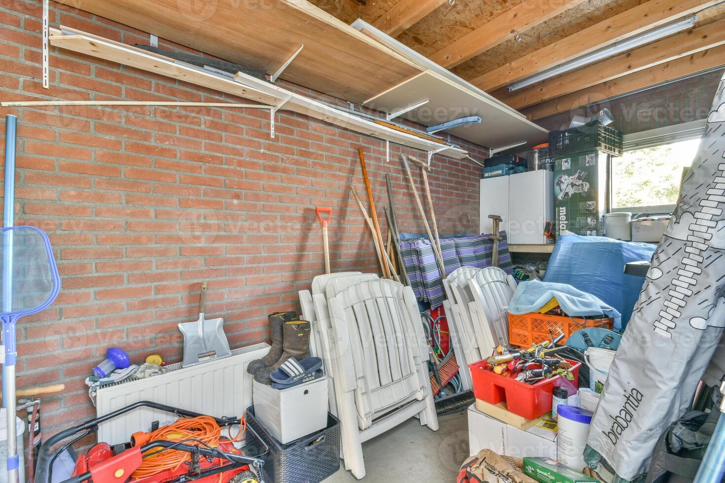 A garage with a lot of tools and other items photo