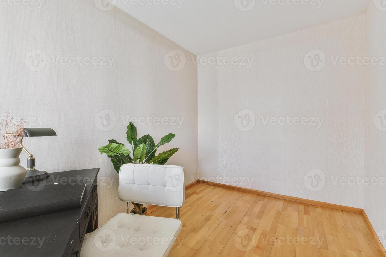 A white chair and desk in a room with hard wood floors photo