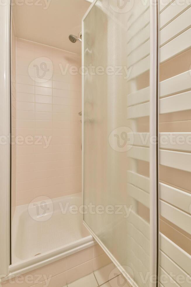 A bathroom with a shower and a sink photo